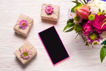 Holyday concept, gift boxes and smart phone