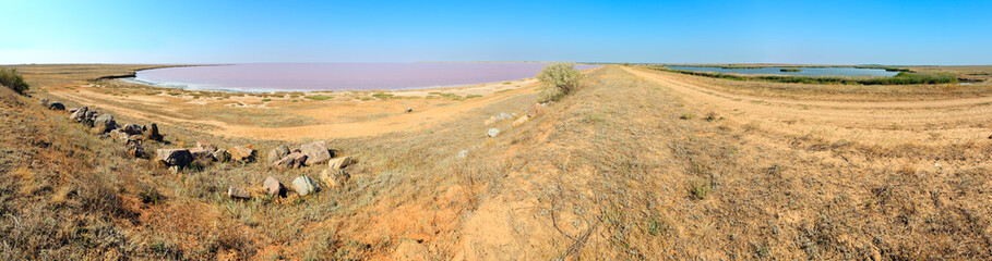 Pink salty Syvash Lake and blue fresh lake by the dam, Ukraine
