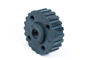 Close-up of a crankshaft gear on an isolated white background. New spare parts