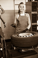Mechanic working on car wheel