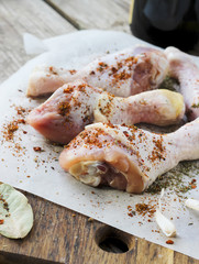 Raw chicken legs with spices