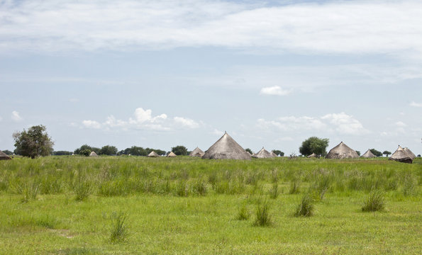 Village with grass huts on the plains of South Sudan.