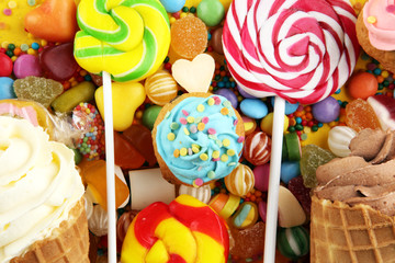 candies with jelly and sugar. colorful array of different childs sweets and treats.