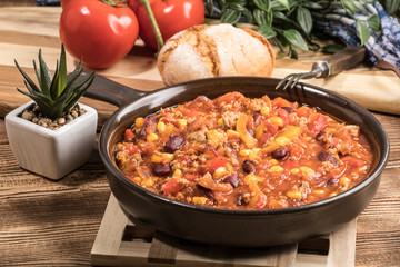 Chili con carne in a clay pan.