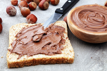 Homemade hazelnut spread in wooden bowl. Hazelnut Nougat cream