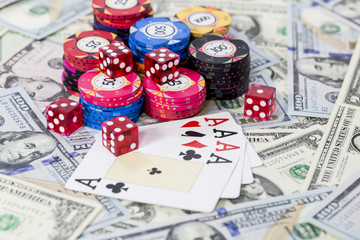 Dollars, Cards of Four Ace, Poker Chip and Dice
