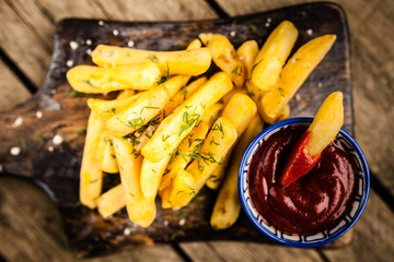 French fries on wooden table