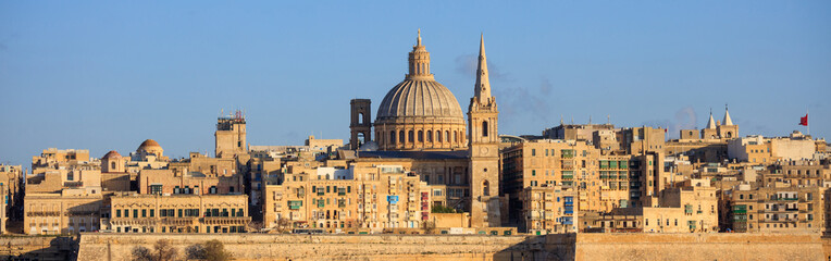 Fototapeta na wymiar Valletta, Malta, Skyline in the afternoon with the dome of the Carmelite Church and the tower of St Paul`s