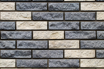 Weathered stained old brick wall background. close-up