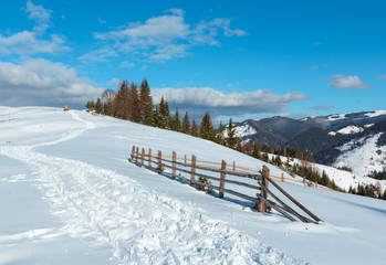 Fototapeta na wymiar Winter morning mountain rural snow covered path