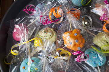 Assorted colorful candies in pack with ribbon.