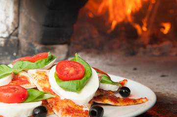 italian flag on pizza and wood oven
