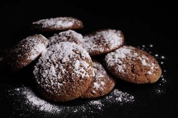 oatmeal cookies on a black table in castor sugar