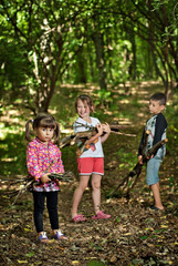 children collect firewood in the woods