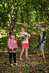 Fototapeta premium children collect firewood in the woods