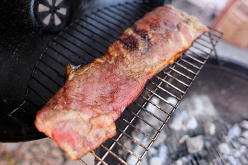 Dry rub pork ribs on the BBQ grill.