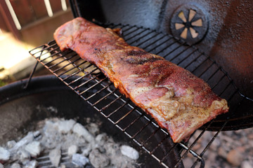 Dry rub pork ribs on the BBQ grill.