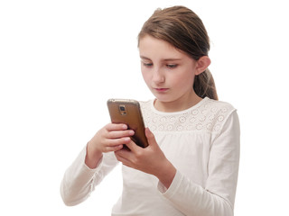 Girl checking something on her smartphone, white shirt, white background.