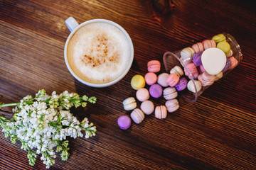 Cappuccino, macaroons and lilac.