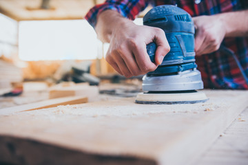 Carpenter At Work Using Jointer Plane. Close up