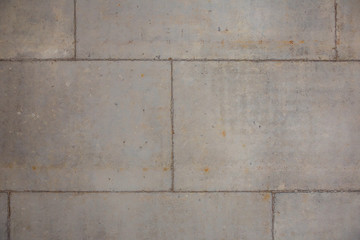 Concrete wall of gray color from fragments. Abstract background