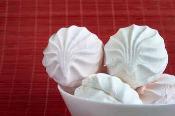 White zephyr marshmallow on porcelain plate