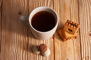 Cup of Tea with Cookies on wooden background