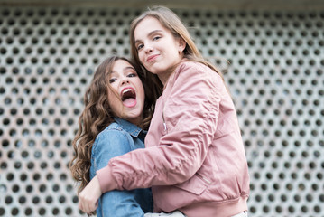 two beautiful young teenage girl having fun in the city.