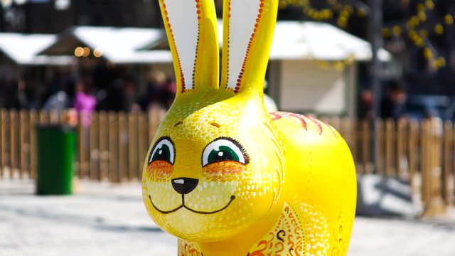 Easter rabbit figure with city background