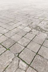 Full frame background of old and weathered cement paving slabs outdoors