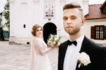 Young wedding couple enjoying romantic moments outside