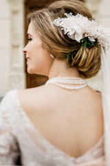 Obraz na płótnie Canvas Bride with wedding makeup and hairstyle. Smiling bride. Wedding 