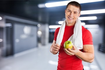 Athletic man with towel on neck