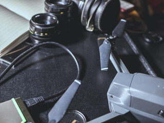drone travel kit on black surface with camera lenses