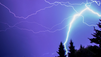 Naklejka na ściany i meble Thunderstorm with bright lightnings next to Neuwied, Germany
