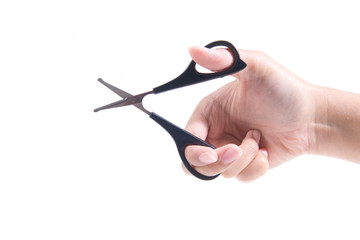 Female hand holding scissors on white background