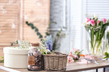 Decorator's workplace with beautiful flowers on table