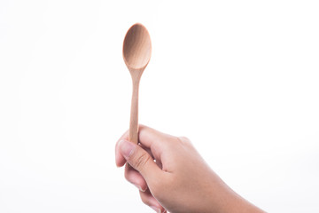 Woman hand with wooden spoon isolated on white background