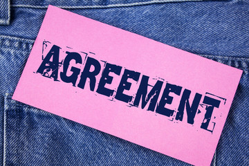 Handwriting text Agreement. Concept meaning Business or personal closures made easy with better guidance written on Sticky Note Paper on the Jeans background.