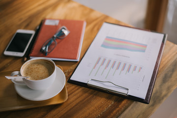 Cup of art latte or cappuccino coffee with retro filter effect