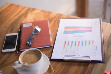 Cup of art latte or cappuccino coffee with retro filter effect