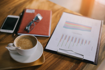 Cup of art latte or cappuccino coffee with retro filter effect