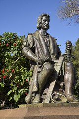 Fototapeta na wymiar Christopher Columbus statue inthe Santa Catarina Park overlooking the harbour in Funchal Portugal is a haven of shady trees and lawns in the centre of the city 