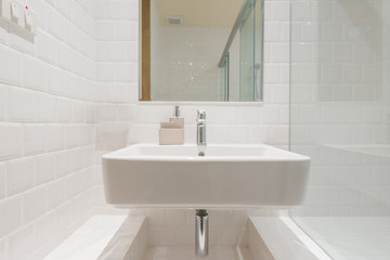Bathroom interior with sink and faucet.