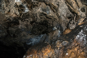 View inside a deep cave. The dark abyss.