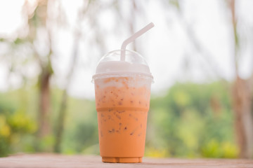 Ice thai tea on wooden table