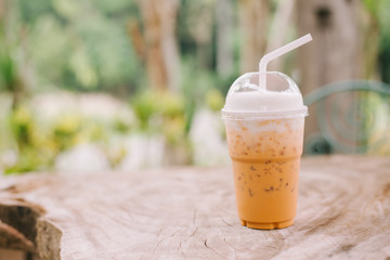 Ice thai tea on wooden table