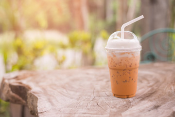 Ice thai tea on wooden table
