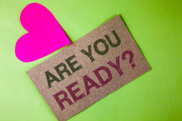 Conceptual hand writing showing Are You Ready Question. Business photo text asking about availability Lets go out Study Work written on Cardboard Piece on the plain background Heart next to it