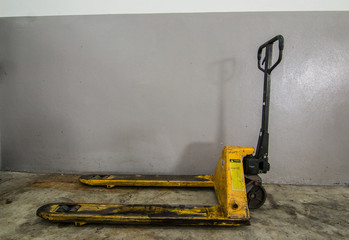 Hand pallet truck in the warehouse.